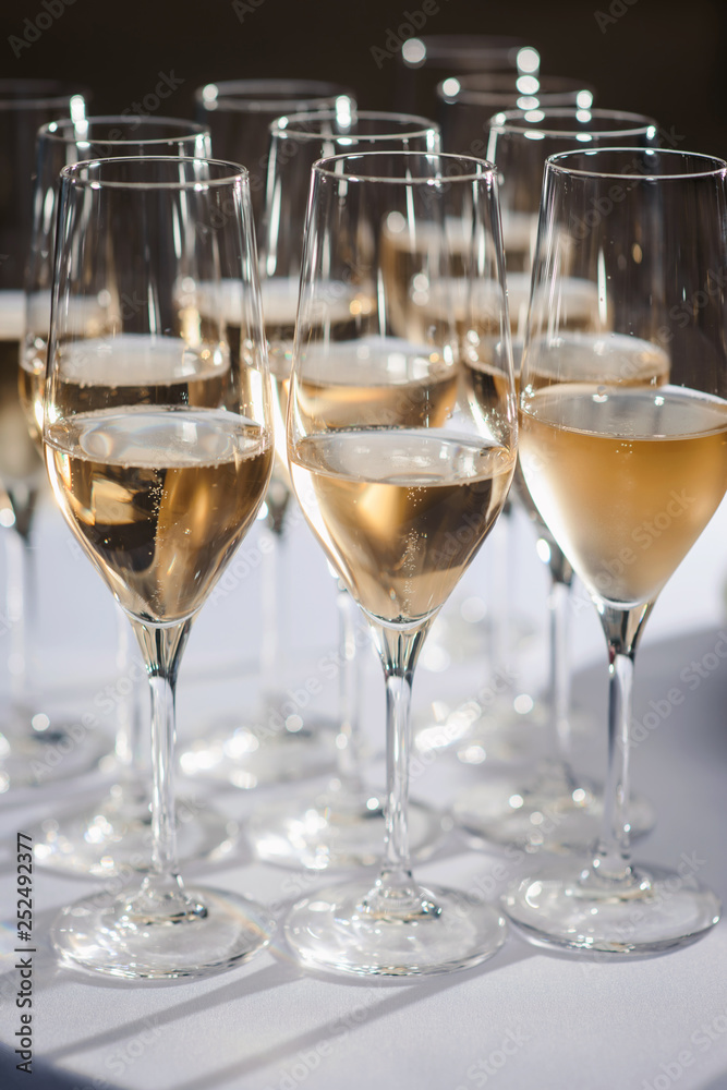 Glasses with champagne or wine at the event. Catering concept Glasses with champagne or wine at the event. Catering concept