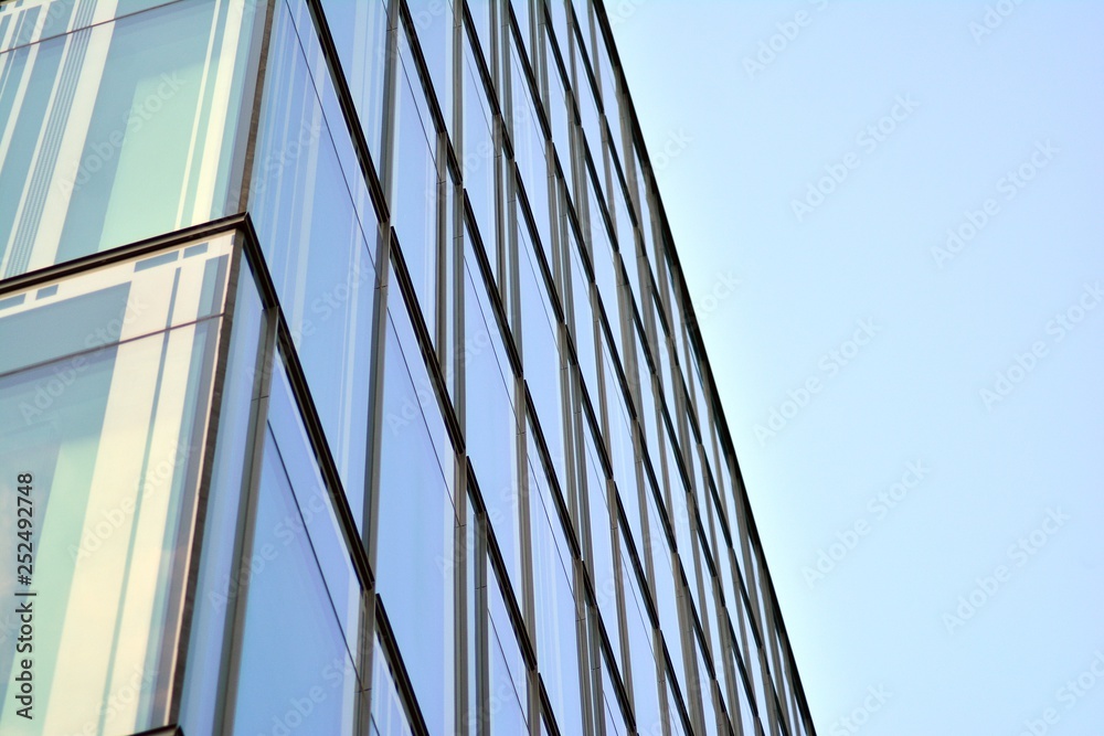 The windows of a modern building for offices. Business buildings architecture. The windows of a modern building for offices. Business buildings architecture.