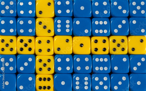 National flag of Sweden in background of dices