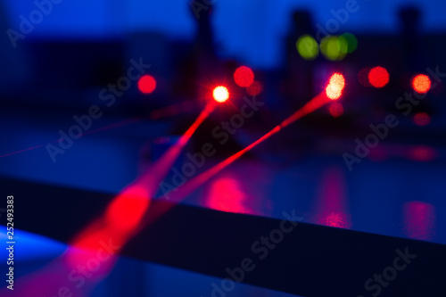 Experiment with a red laser in a physics lab