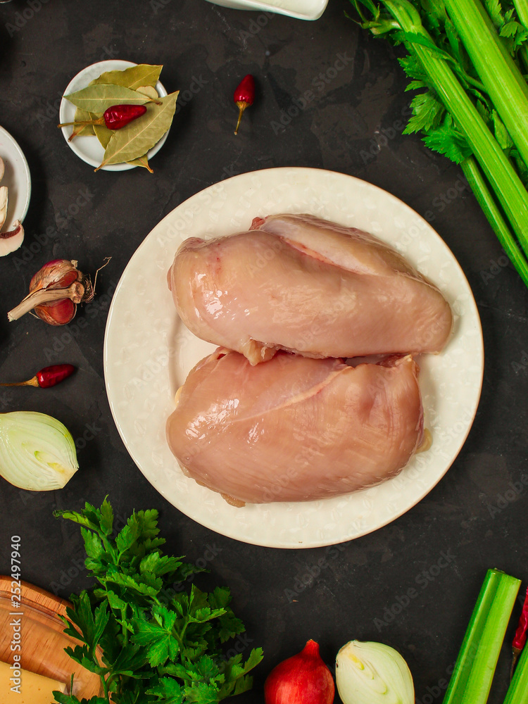 chicken breast, raw meat fillets and other ingredients (vegetables, vegetables, spices, mushrooms and others). food background. copy space chicken breast, raw meat fillets and other ingredients (vegetables, vegetables, spices, mushrooms and others). food background. copy space