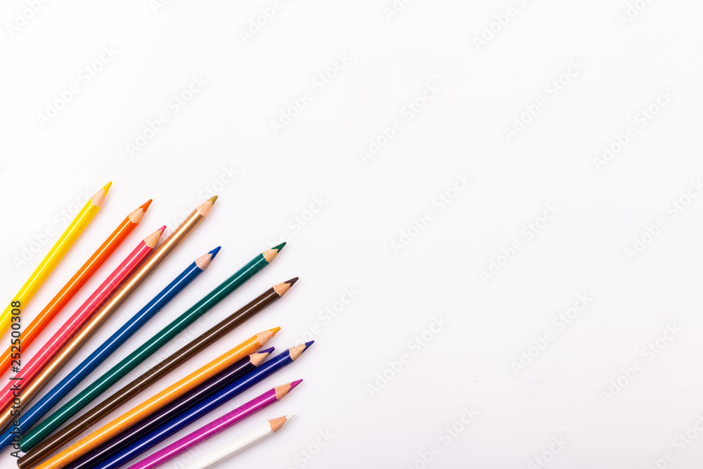 Colorful pencils pattern isolated on white background. Top view