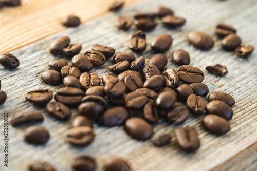 Roasted coffee beans on rustic wooden boards