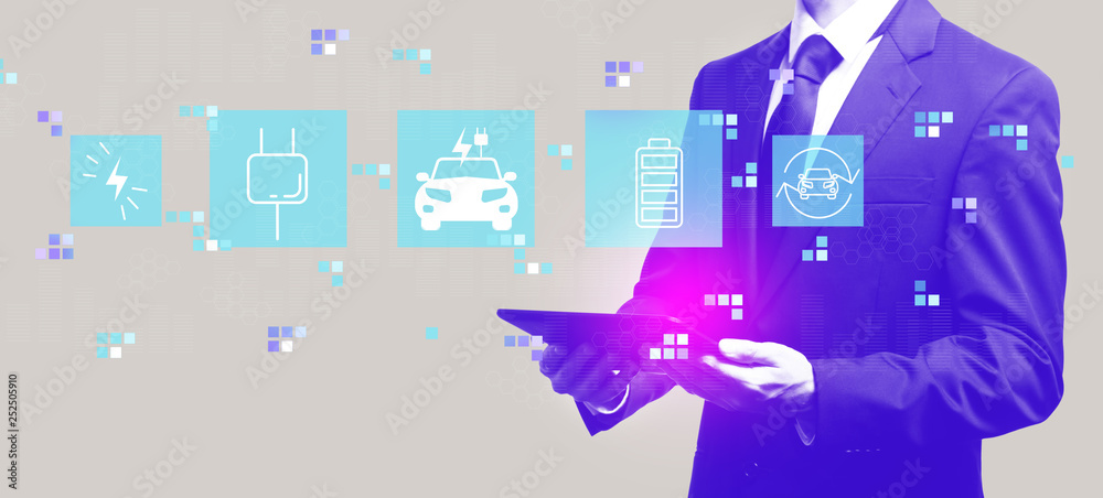 EV with businessman holding a tablet computer EV with businessman holding a tablet computer