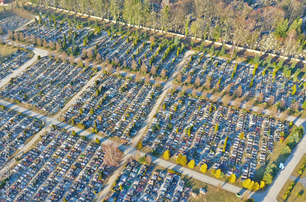 Aerial view on big cemetery, many tombstones and trees with cross roads. Aerial view on big cemetery, many tombstones and trees with cross roads.