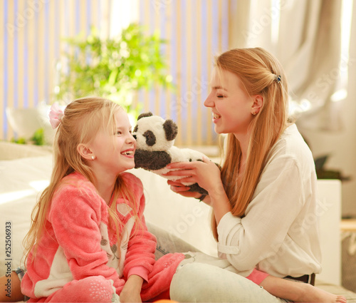 Young mother and daughter are having fun playing at home, happy parenting and family leisure