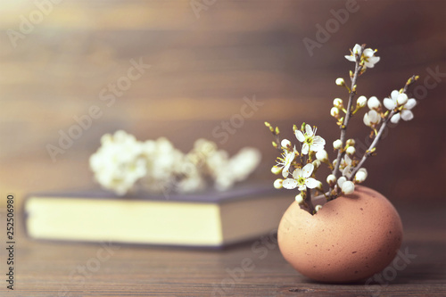Easter decoration. Easter card with spring flowers in eggshell