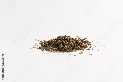 Pile of green tea isolated on white background