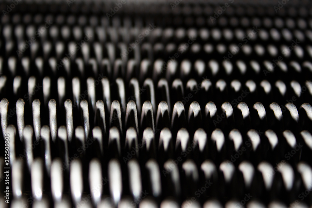 .several stretched tension iron springs .several stretched tension iron springs