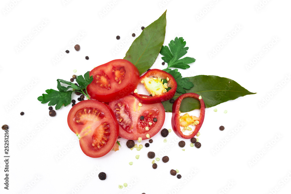 Fototapeta Sliced fresh tomatoes, bell peppers, seasonings and greens, isolated on white background. top view.