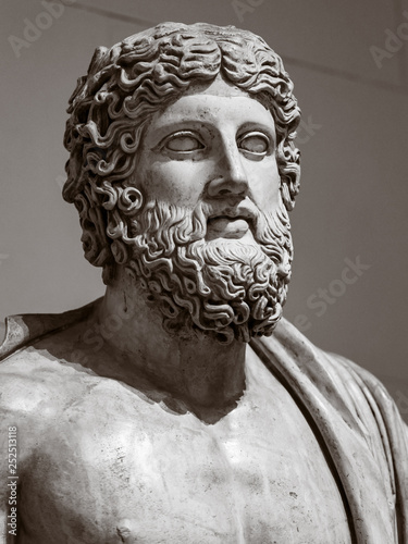 The statue of an ancient Greek man with a beard