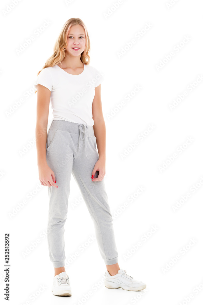 Little school girl pointing to her empty white t-shirt. Little school girl pointing to her empty white t-shirt.