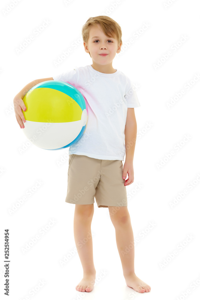 A little boy is playing with a ball. A little boy is playing with a ball.