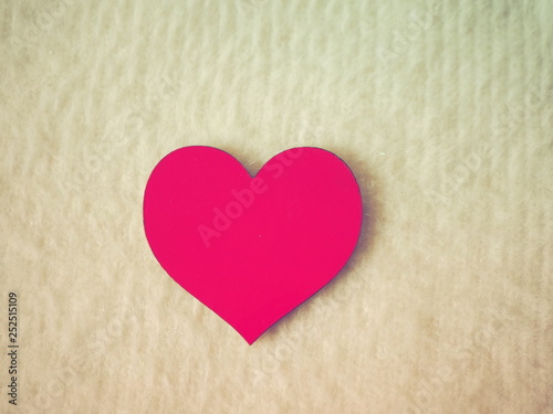 Pink heart on light background