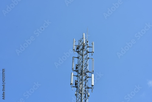 Wireless Communication Antenna With bright sky.Telecommunication tower with antennas with blue sky.