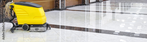 Obraz na plátně Cleaning machine on marble floor in office, vacuum equipment for cleaning in interior of company or luxury hotel
