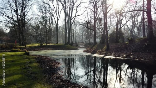 Panning footage at Ohlsdorf cemetery Hamburg, Germany, tranquil morning scene photo