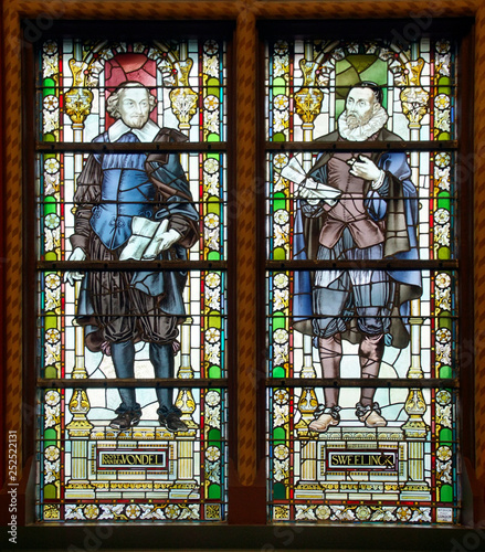 Stained glass windows of great hall of the Rijks Museum photo