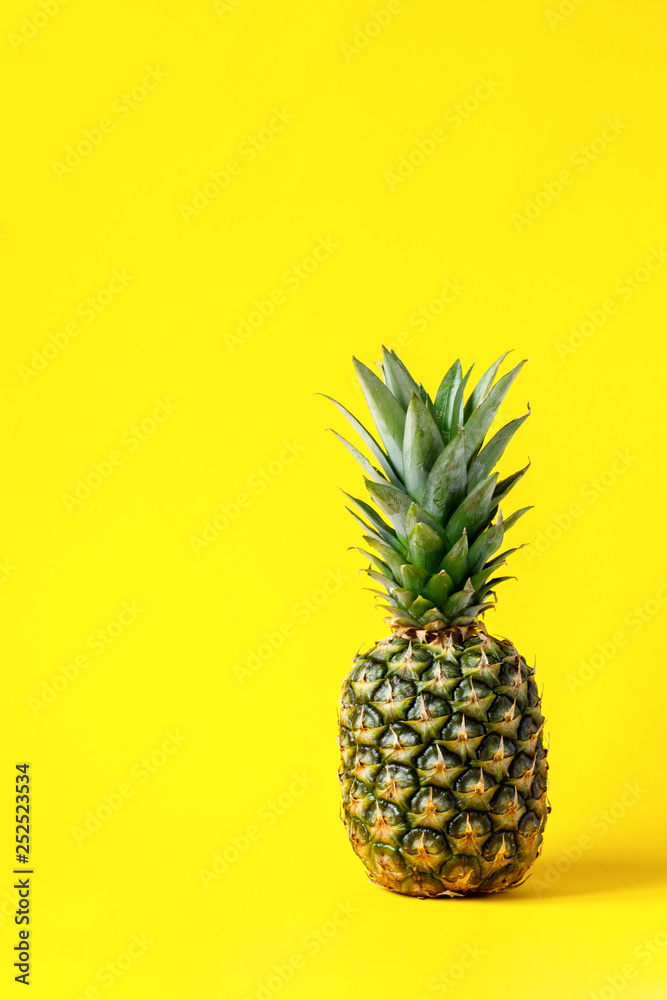 Pineapple on brightly yellow background. Minimal style. Food Idea .Summer concept.Copy space for Text. Pineapple on brightly yellow background. Minimal style. Food Idea .Summer concept.Copy space for Text.