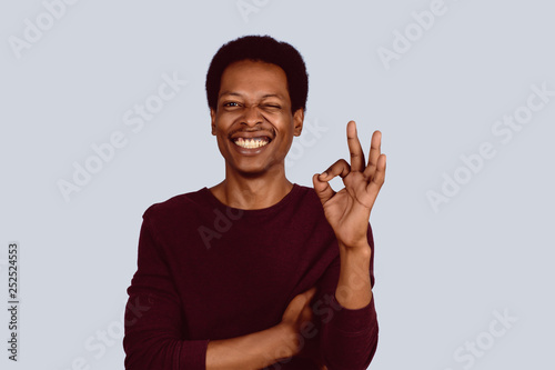 Afro American man showing okay gesture photo