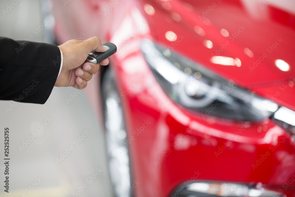 Young businessman at the car dealership Young businessman at the car dealership
