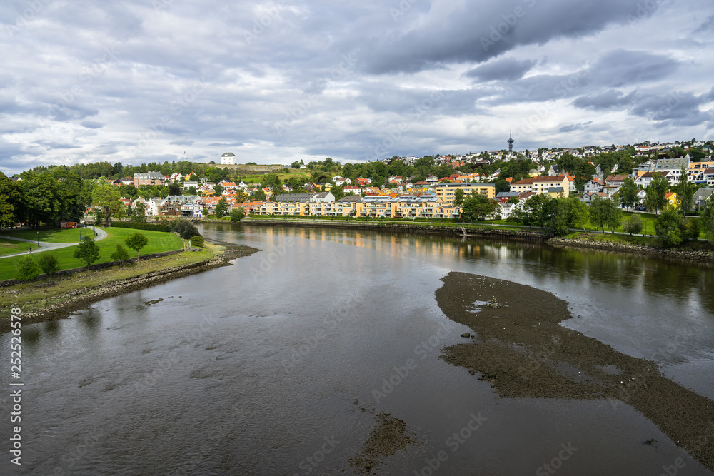 Trondheim city with Nidelva River and Kristiansten Fortress on a hill in the background, Norway
