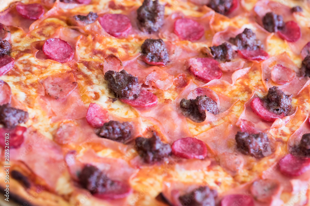 Delicious freshly baked pizza taken close up. Delicious freshly baked pizza taken close up.