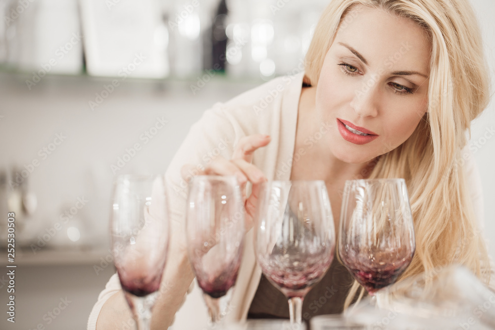 Gorgeous mature woman shopping for glassware