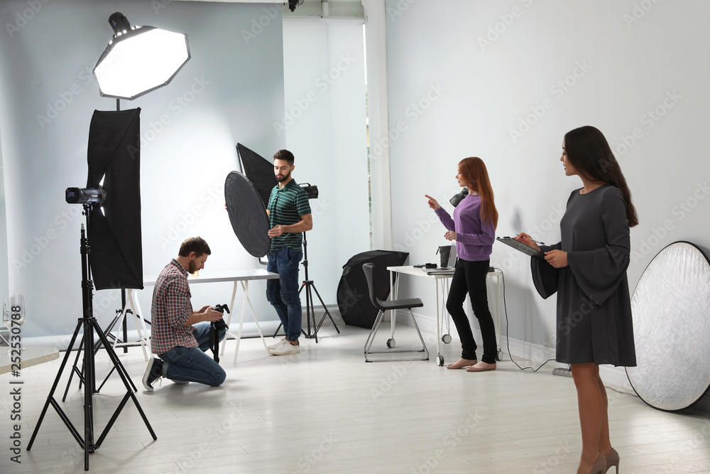 Photo studio with professional equipment and team of workers Photo studio with professional equipment and team of workers