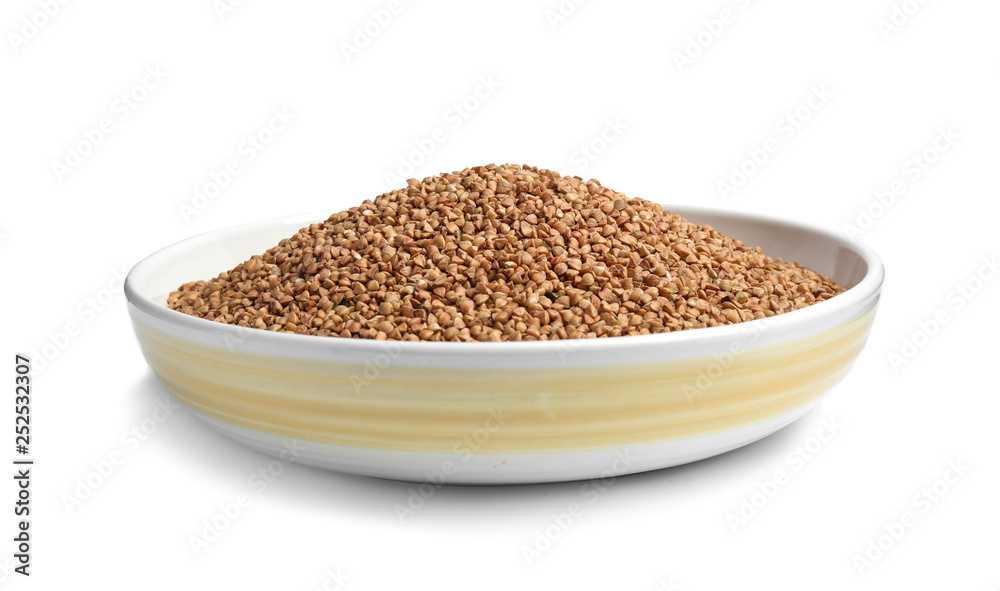 Bowl with uncooked buckwheat on white background Bowl with uncooked buckwheat on white background