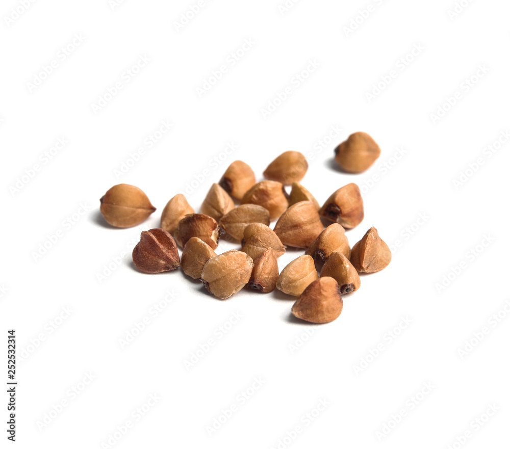 Uncooked buckwheat on white background. Healthy diet Uncooked buckwheat on white background. Healthy diet