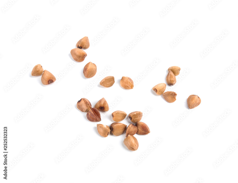 Uncooked buckwheat on white background. Healthy diet Uncooked buckwheat on white background. Healthy diet