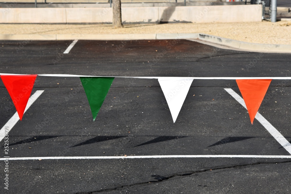 Fototapeta premium colorful pennants in a parking lot
