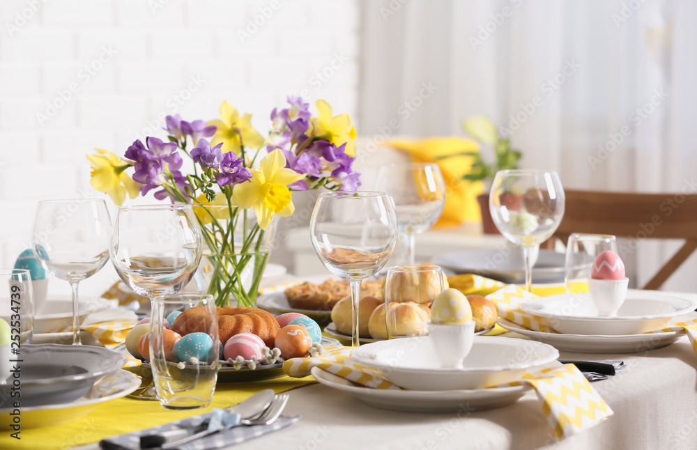 Festive Easter table setting with traditional meal at home Festive Easter table setting with traditional meal at home