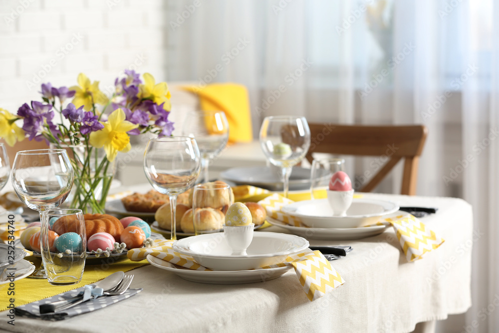 Festive Easter table setting with traditional meal at home, space for text