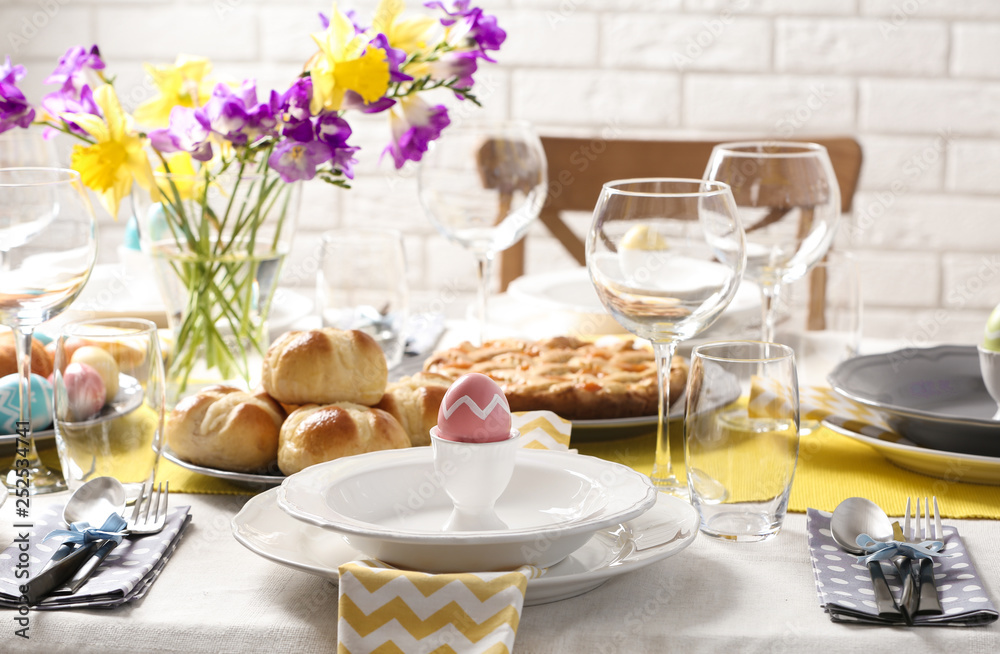 Fototapeta premium Festive Easter table setting with traditional meal at home