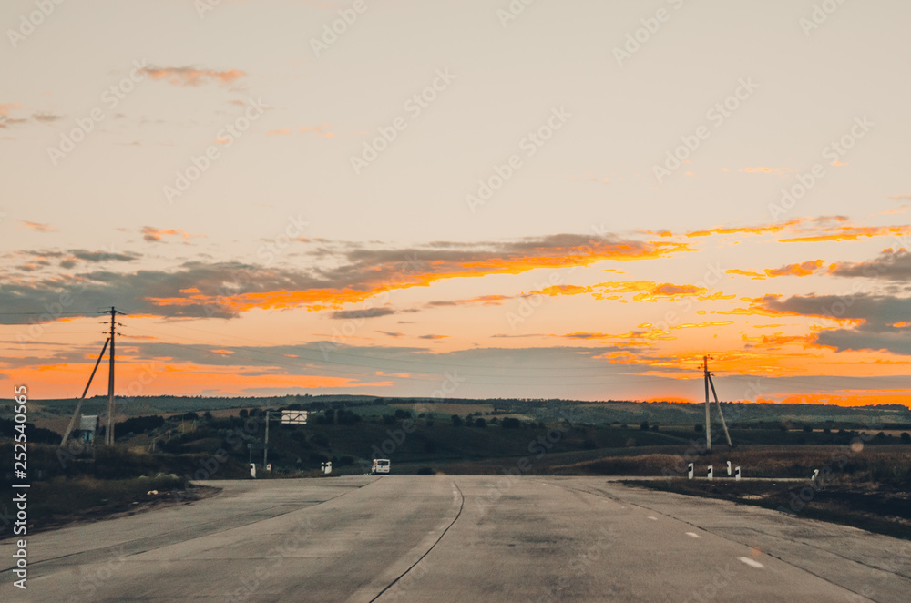 Fototapeta premium sunset view from the car front window