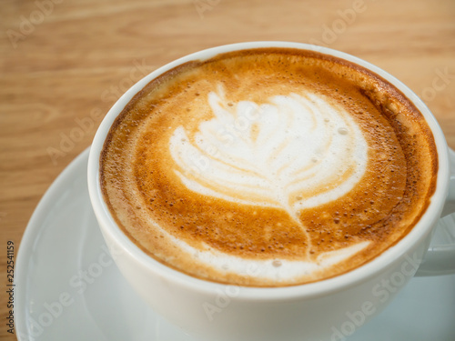 Fototapeta Naklejka Na Ścianę i Meble -  Cup of latte art coffee in the coffee shop