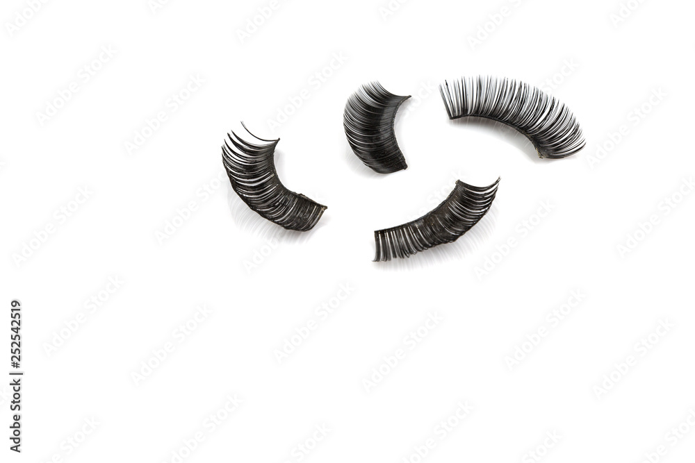 Old used false eyelash isolated on white Old used false eyelash isolated on white
