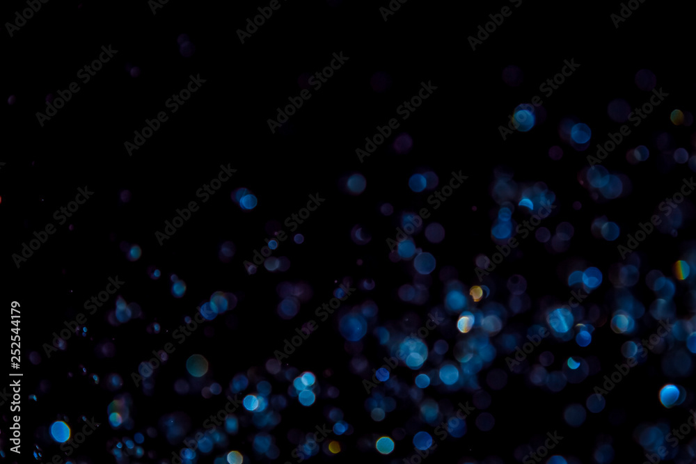 Luxurious Blue bokeh texture on black Luxurious Blue bokeh texture on black