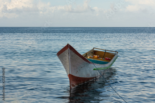 wooden boat parked at the beach © Gao