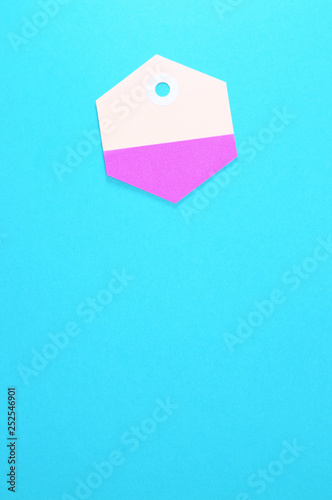 hexagon paper tag on blue background vertical template