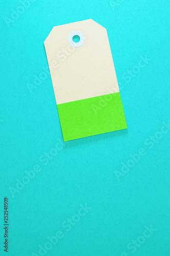 clipped rectangle paper tag on blue background vertical template