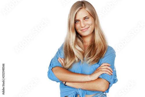 Young beautiful girl woman blond with long hair and blue eyes in a blue shirt isolated white background
