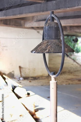 old street light is dirty with shit of dove