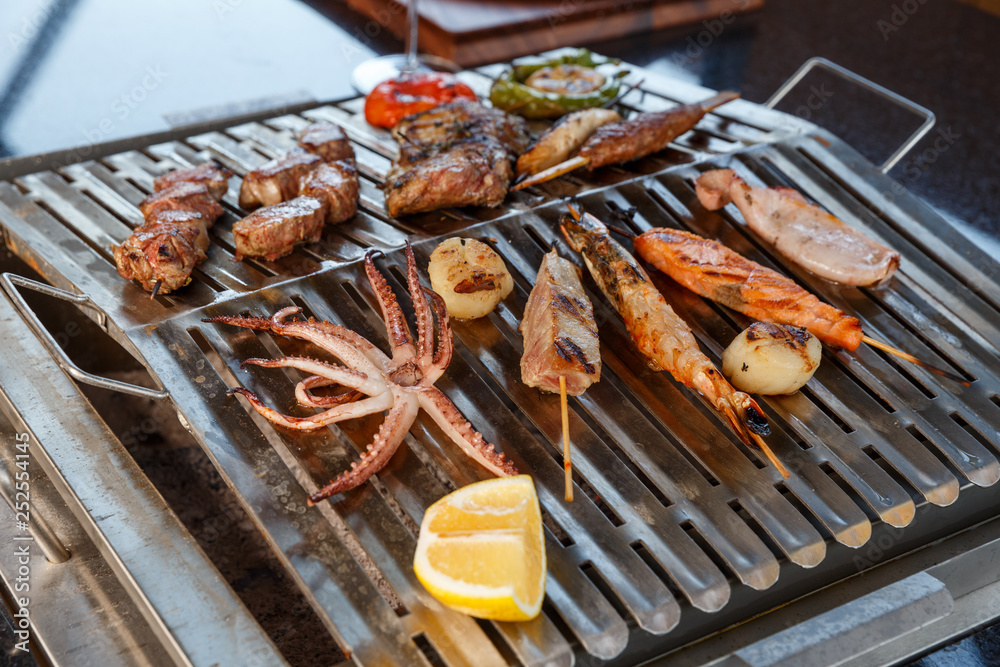 grilled sea food and vegetables on the grill