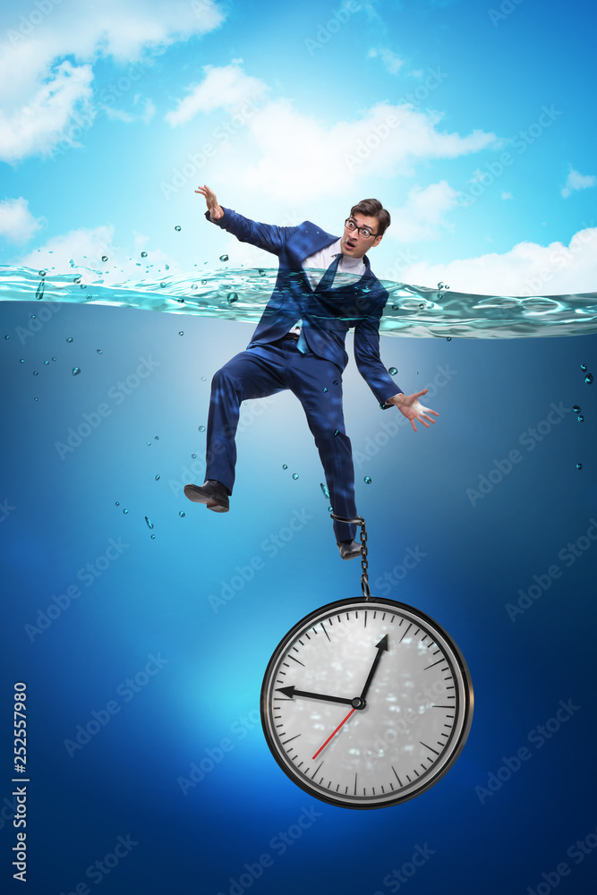 Businessman in deadline and time management concept