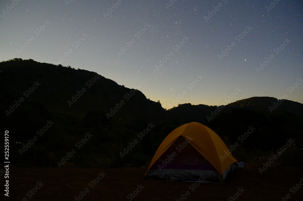 Camping tent mountain view and star with night time.