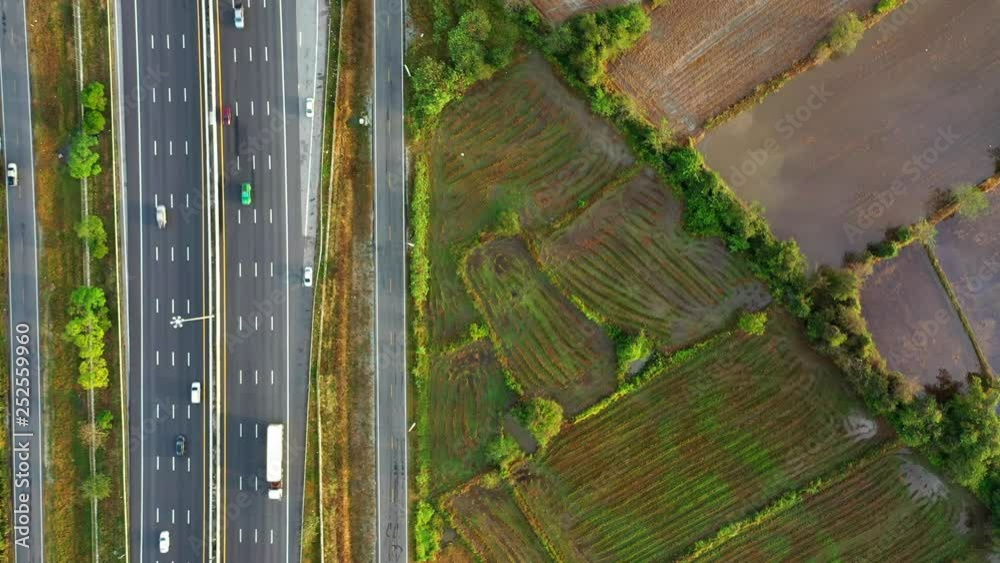 Aerial view of the road next to agriculture in rice fields to prepare cultivation Aerial view of the road next to agriculture in rice fields to prepare cultivation