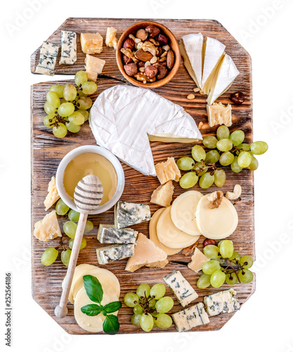 Fotografie Cheese plate served with nuts and honey